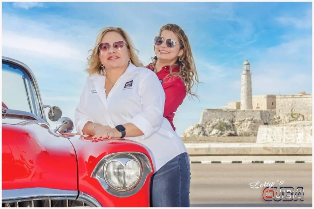 Letty and assistant standing by a car