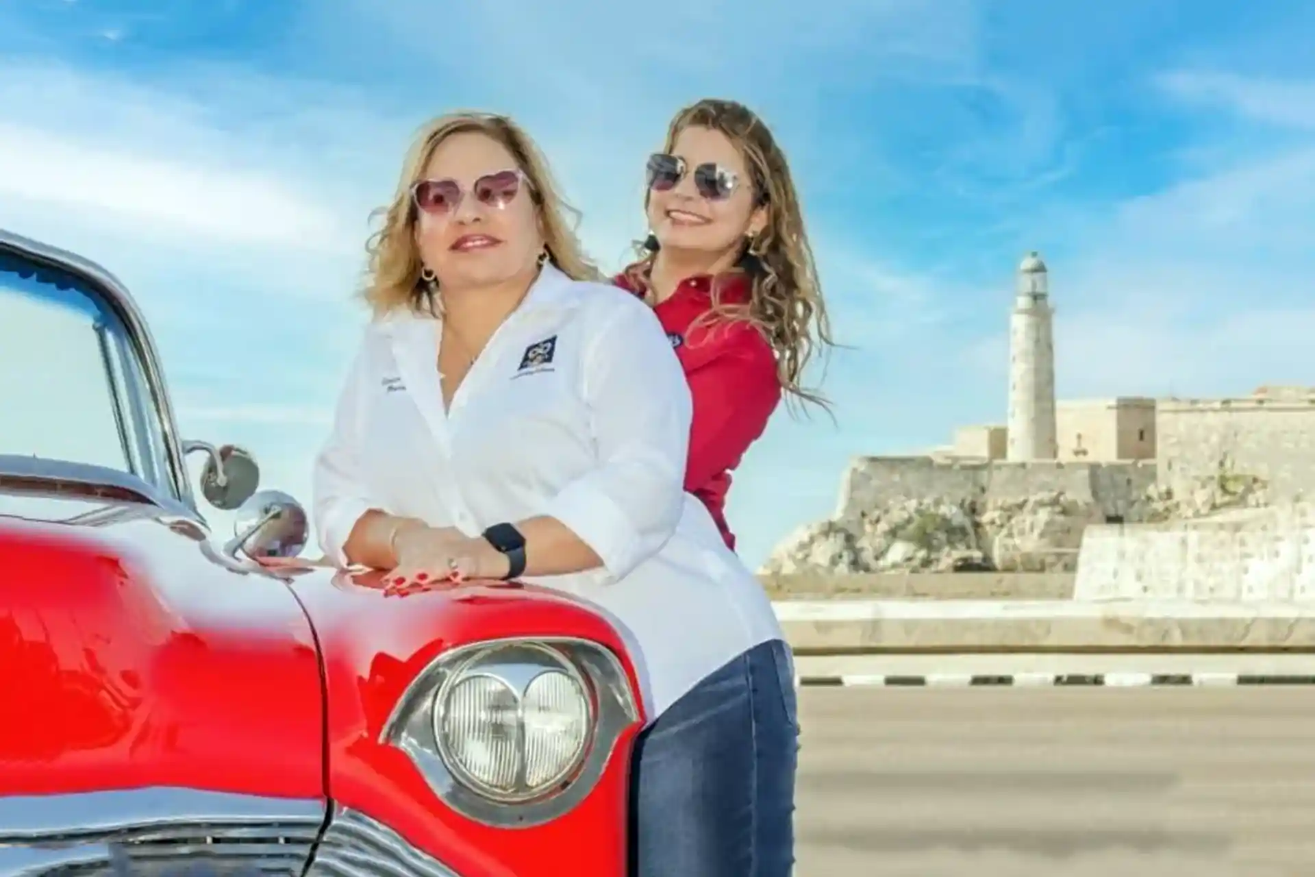 Letty and Yailin next to car in front of fort